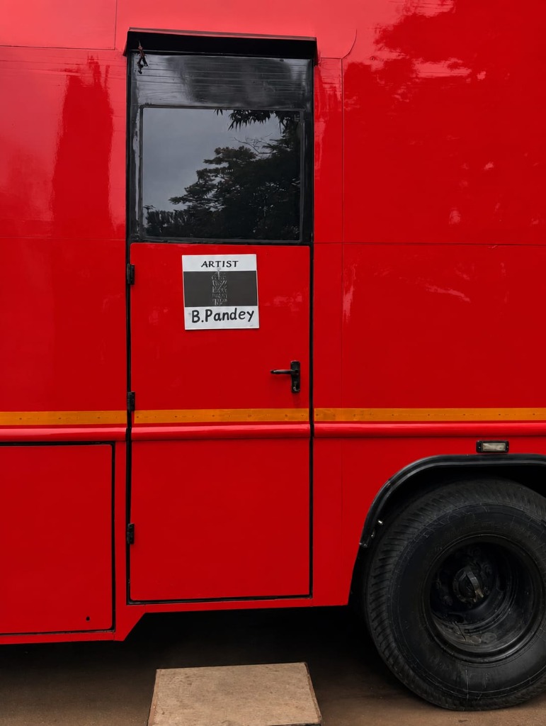 Red artist production caravan door with nameplate B.Pandey