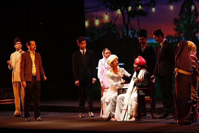 Large ensemble bow on theatre stage